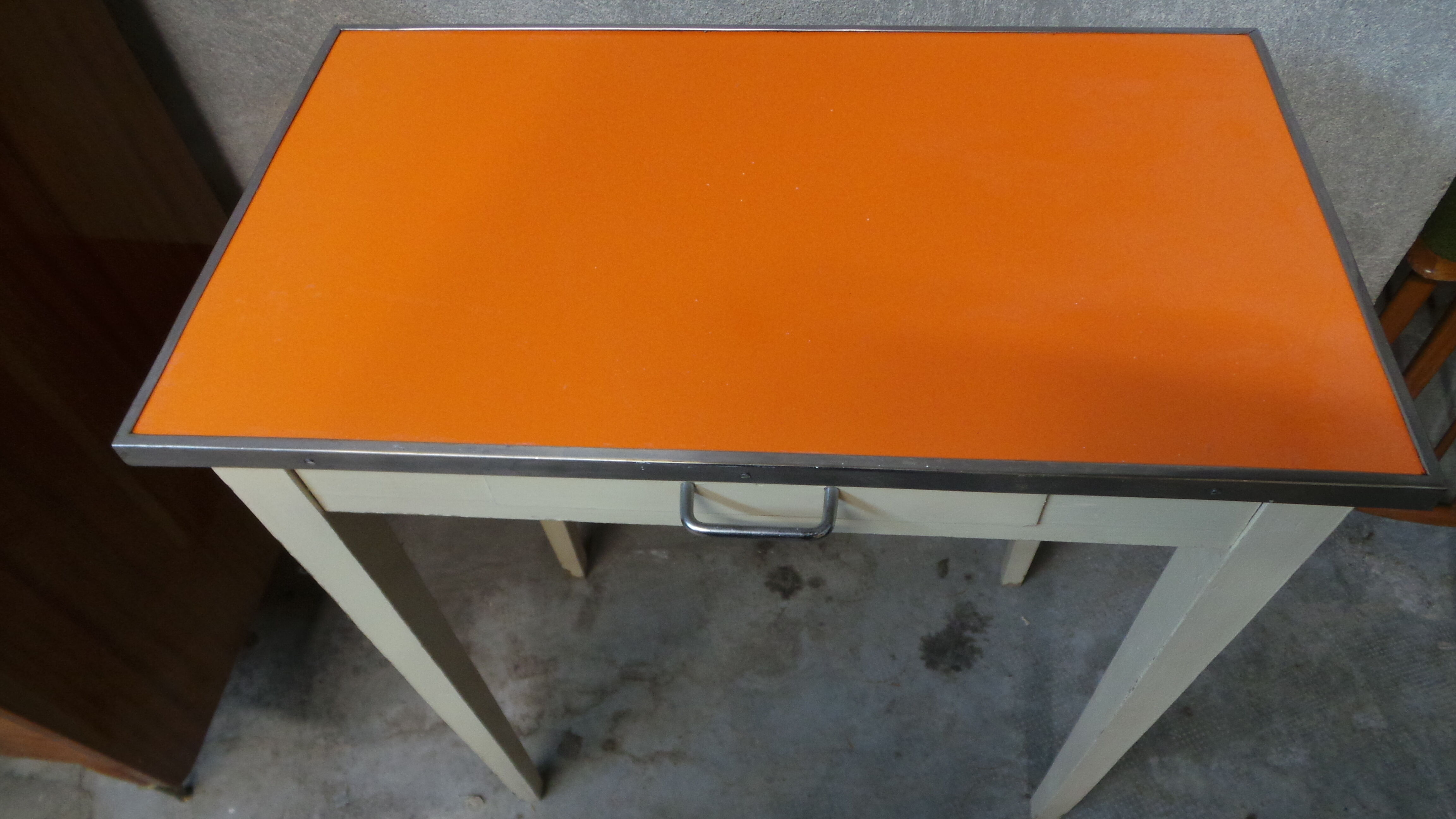 Orange wood and formica table