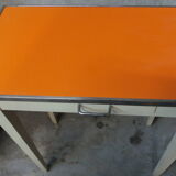 Orange wood and formica table