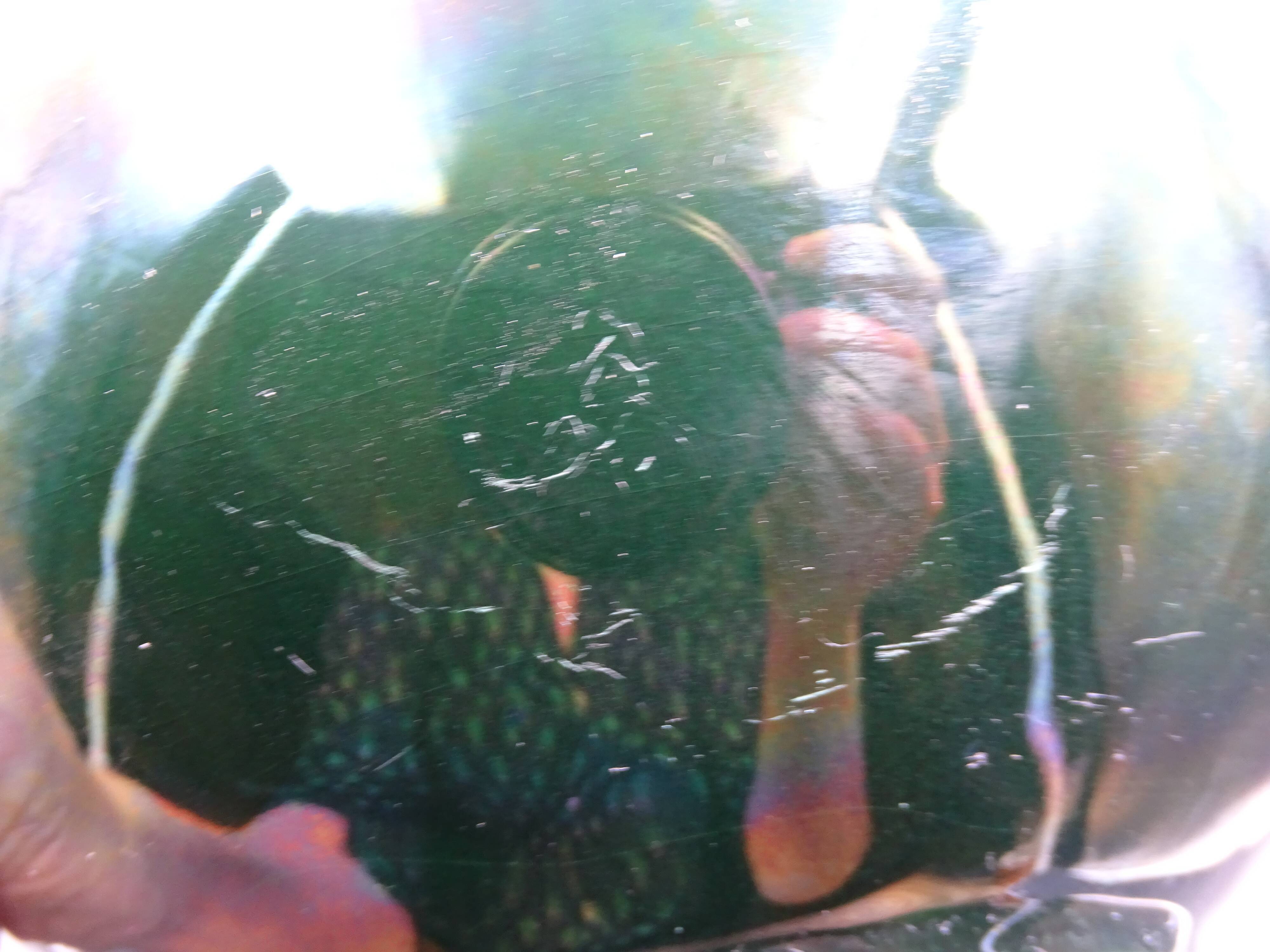 Green faience bowl decorated with multicolored drips around 1970