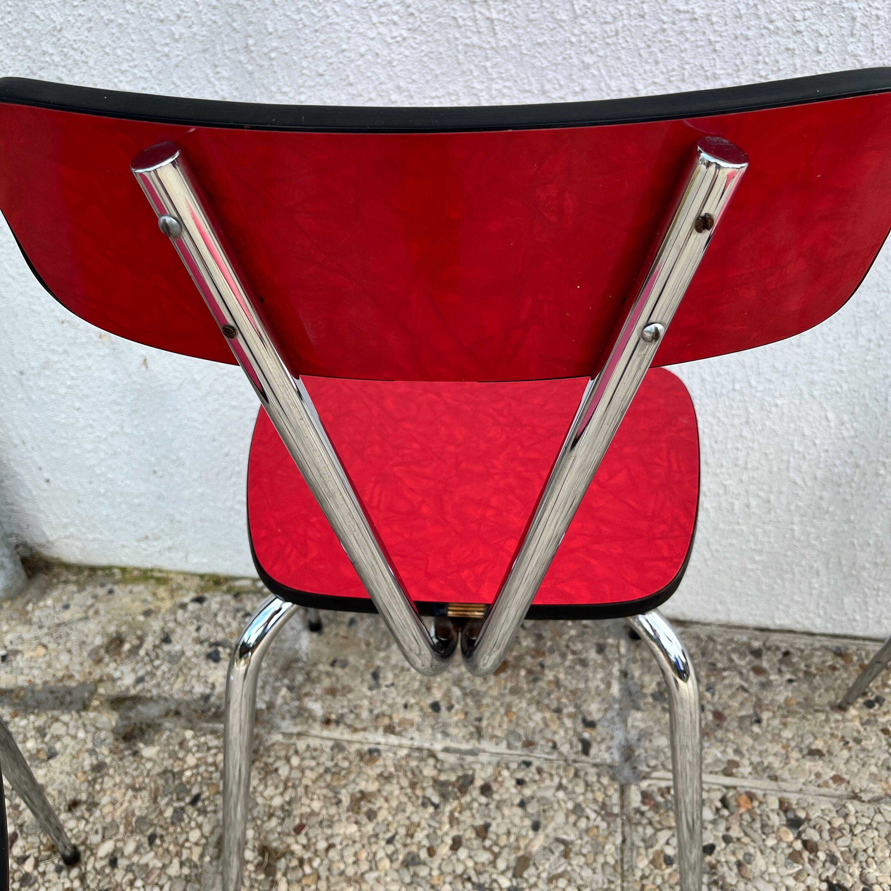 Chairs in formica red foot compass