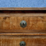 Louis XVI period chest of drawers in marquetry on mahogany background around 1780
