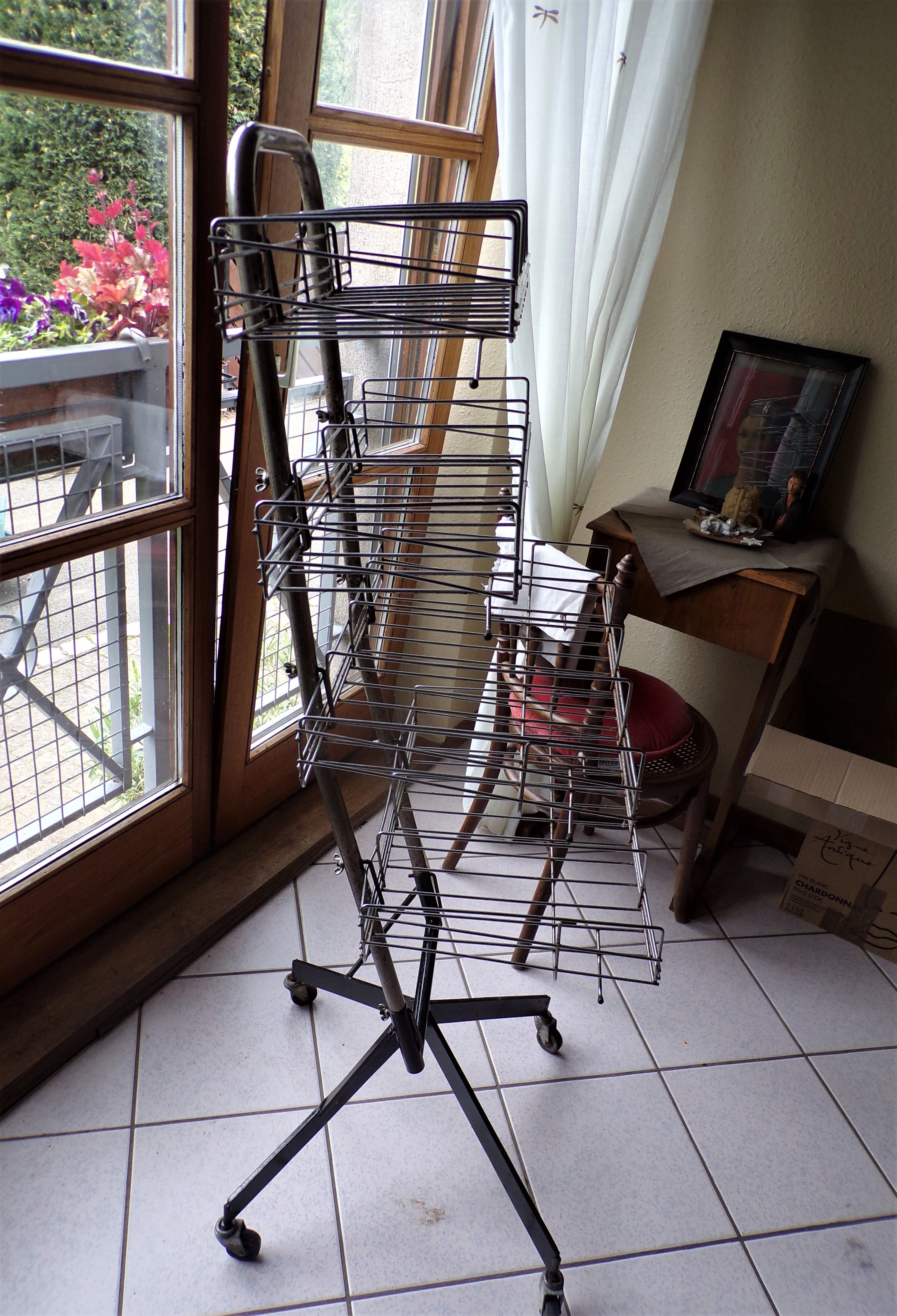Metal grocery shelf on wheels