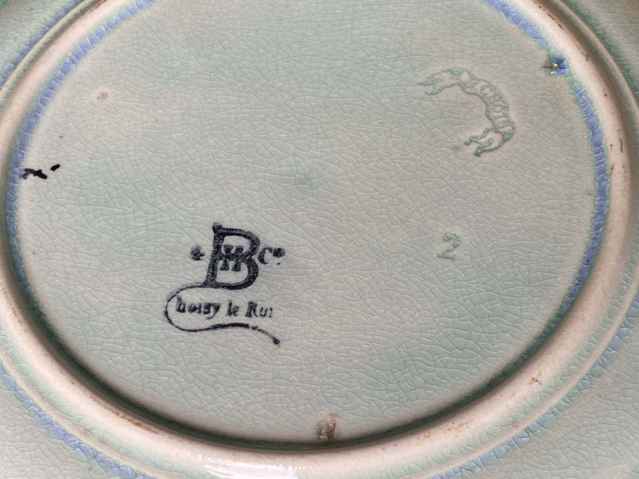 Antique plate from the Choisy Le Roi collection in slip with foliage and flowers