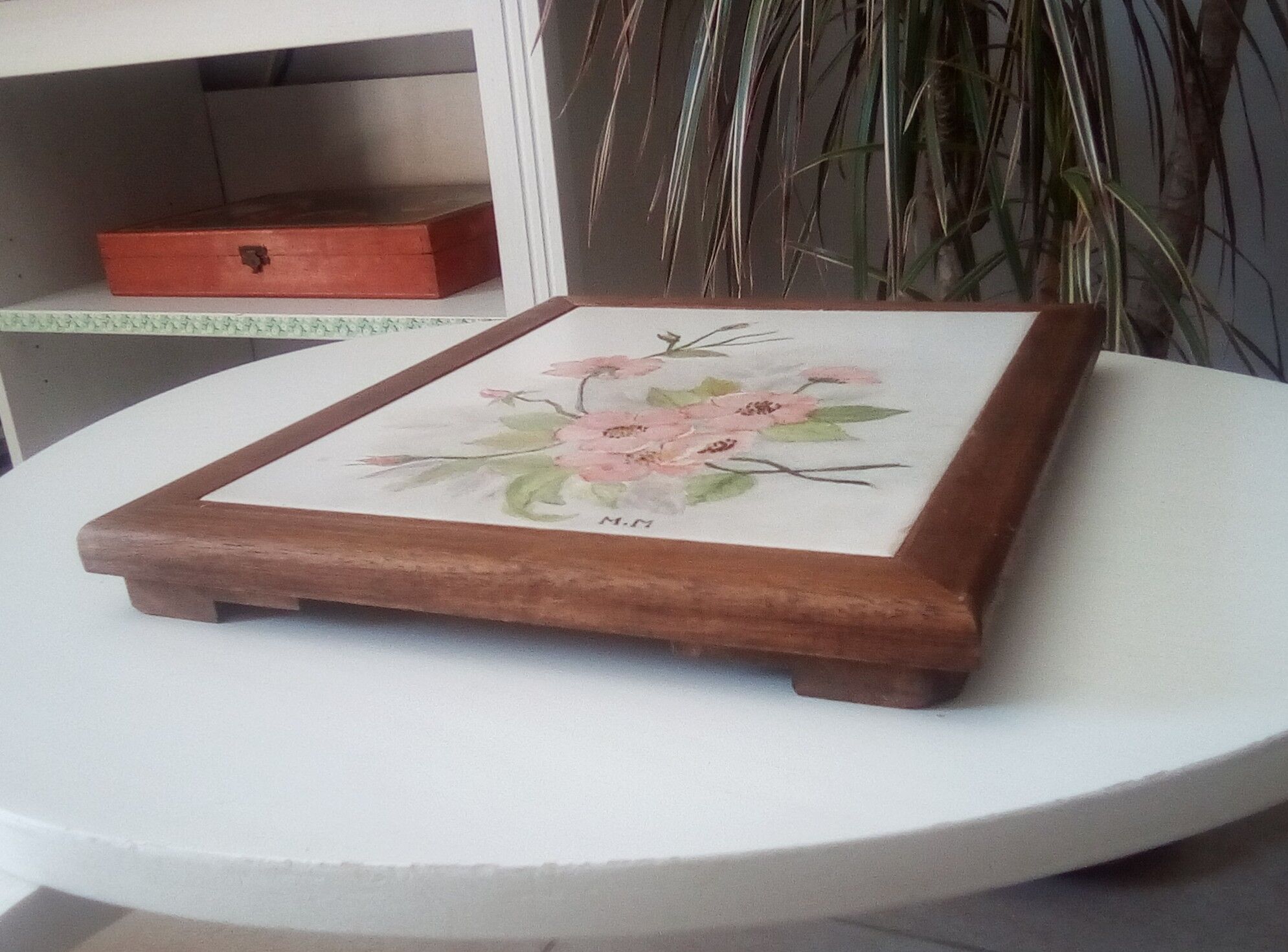 Underside of vintage wood and ceramic dish