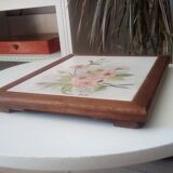 Underside of vintage wood and ceramic dish