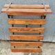 Wall-mounted coat rack in iron and wooden slats