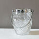 Vintage glass ice bucket stamped with a metal handle