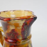 Beautiful ceramic pitcher in fire colors