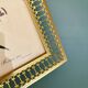 Antique gilt metal frame with flower engraving