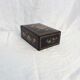 Old black wooden box adorned with roses with keys