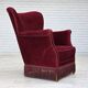 Fauteuil danois des années 1970, velours de mobilier rouge cerise, pieds en bois de chêne.