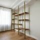 Tension pole free standing rose gold aluminum Omni wall unit by George Nelson