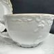 Tharaud Limoges white porcelain cups and saucers with gold relief