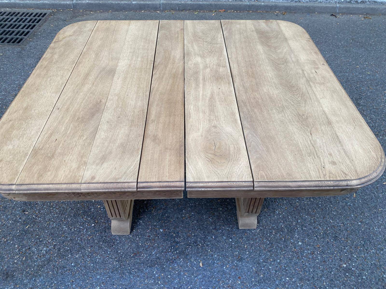 Rectangular Art Deco dining table with a central pedestal, stripped in solid oak.