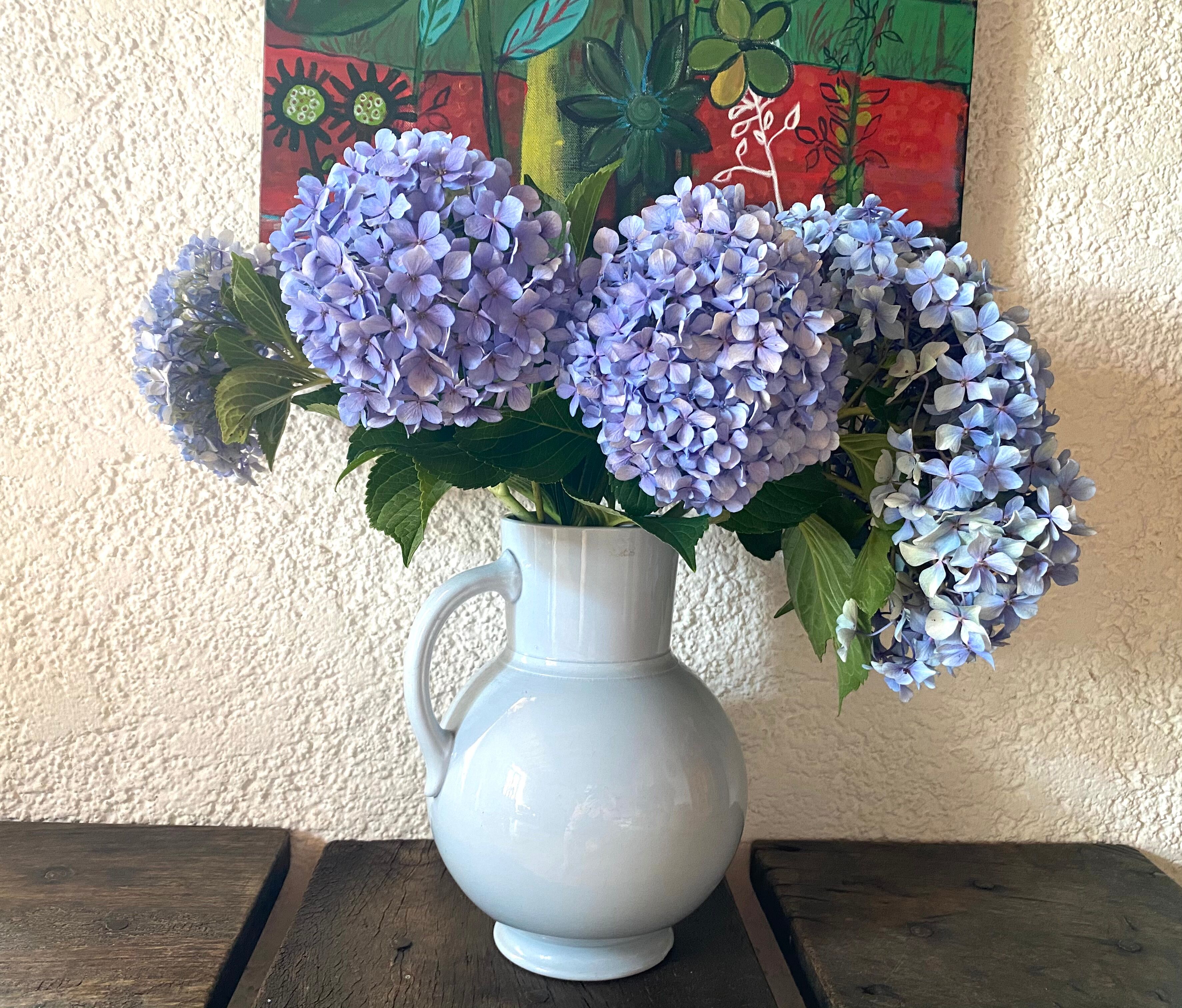 Antique vase in pale blue ceramic