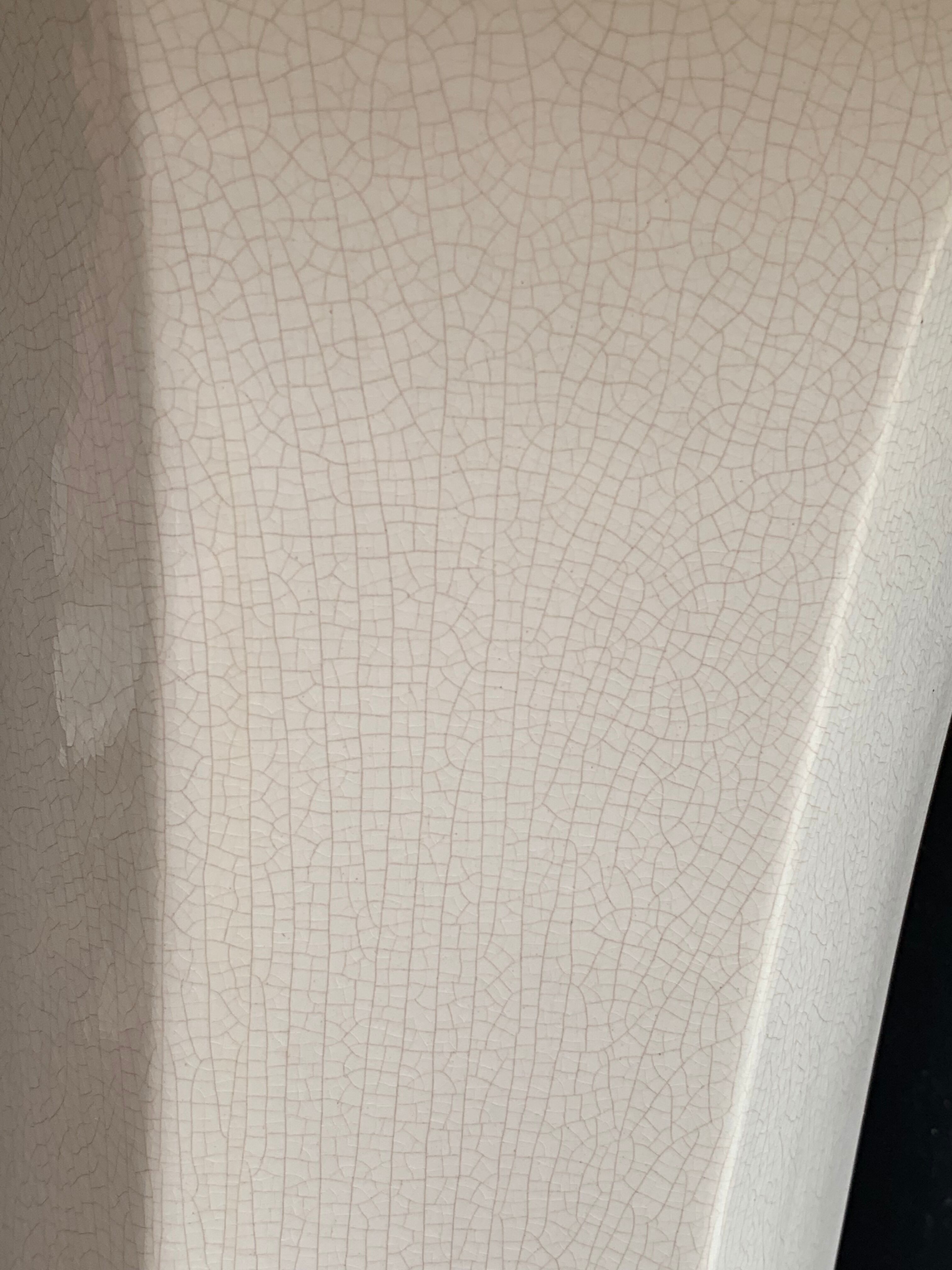 Column wears vintage plant