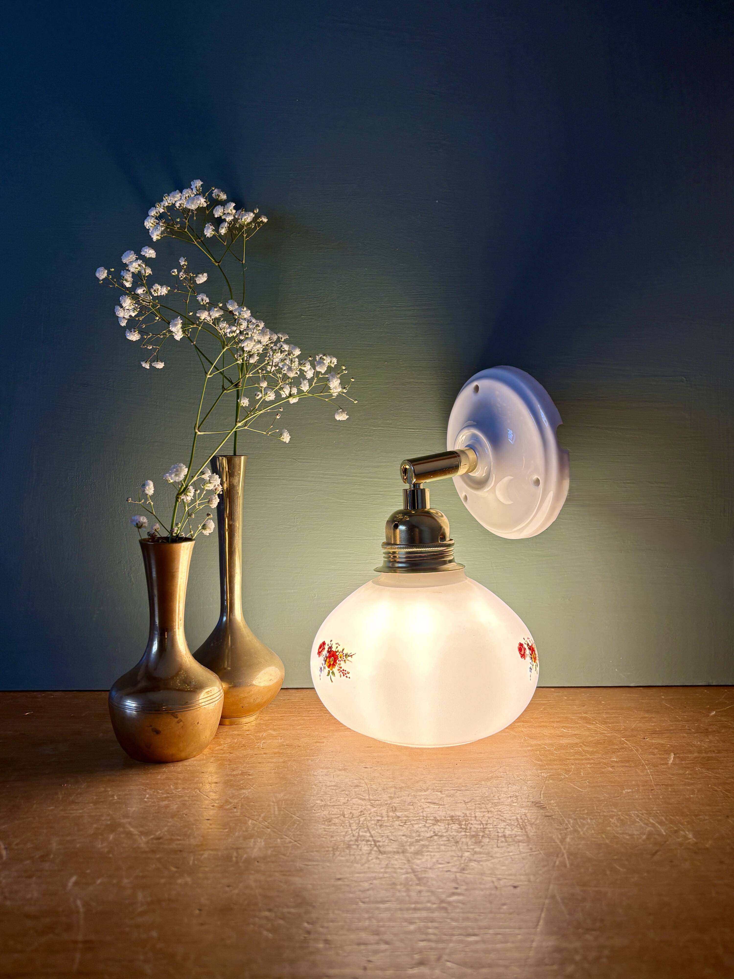 Vintage globe wall sconce in white opaline glass with floral decorations