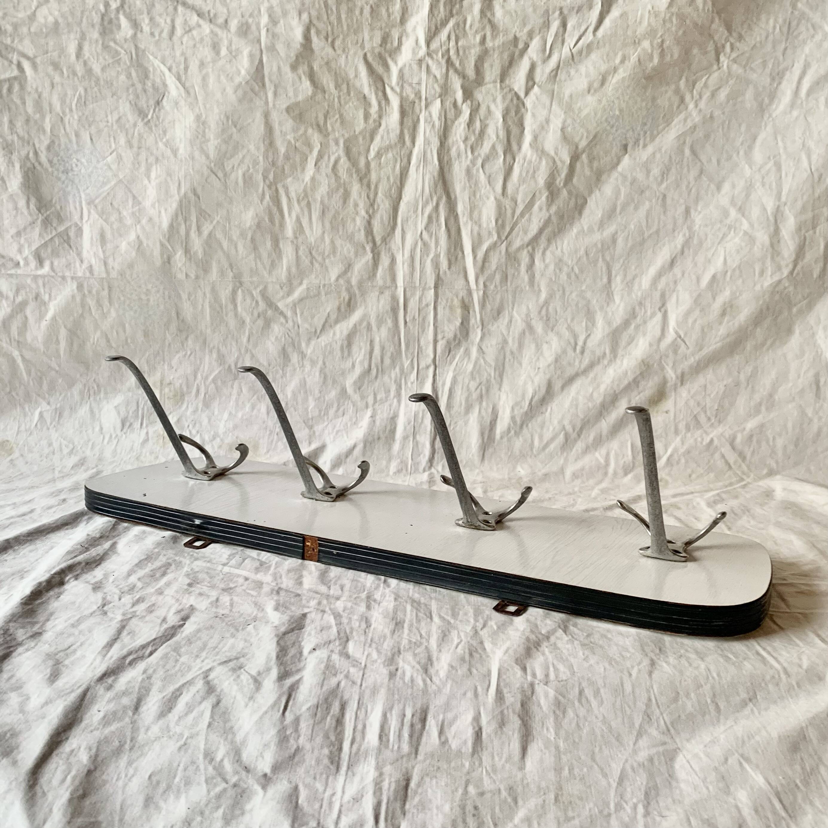 Vintage wall coat rack in white Formica - 4 cast aluminum coat hooks