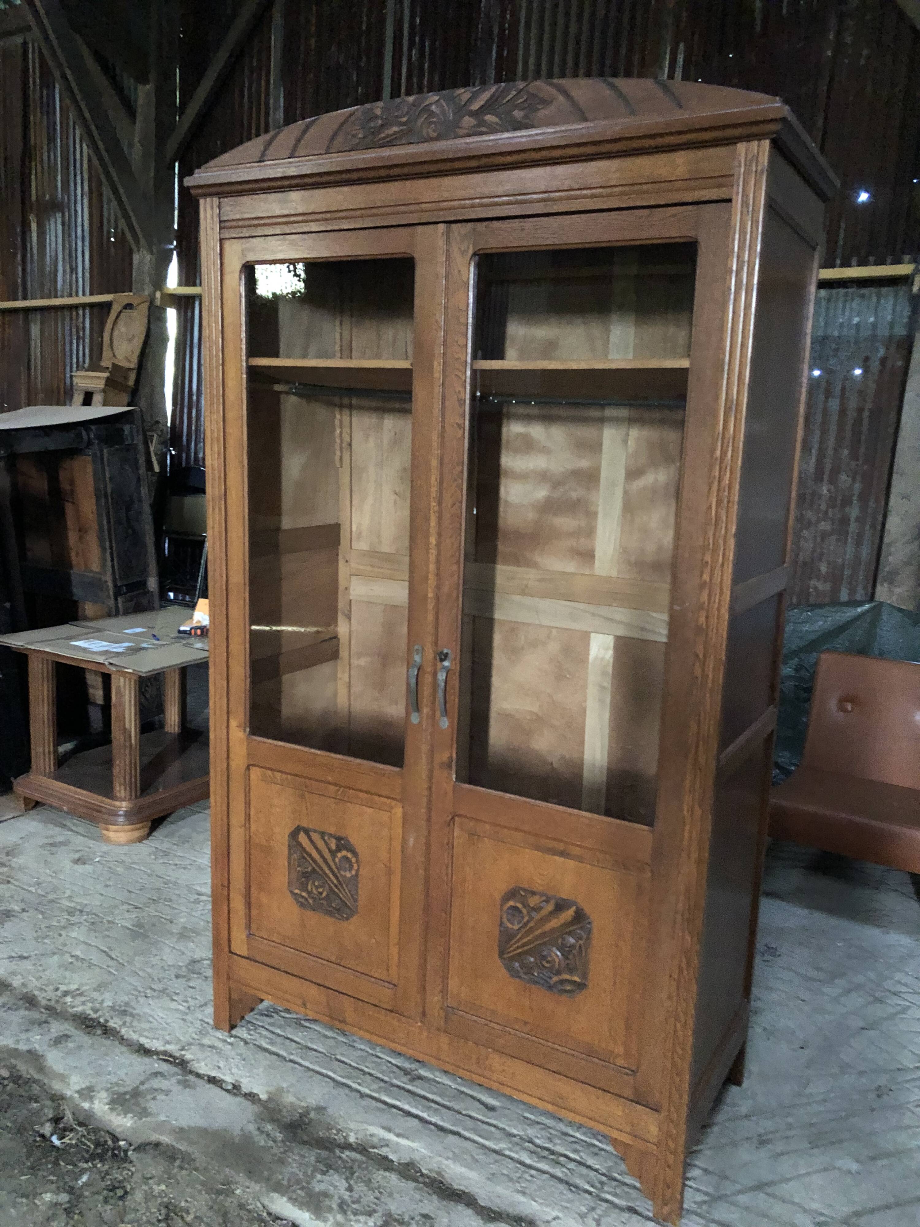 Vintage rococo oak bookcase with 2 glass doors.