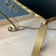 Table basse en métal doré et verre noir 1960