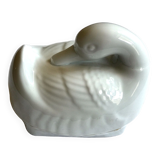Porcelain duck dish with lid on fire