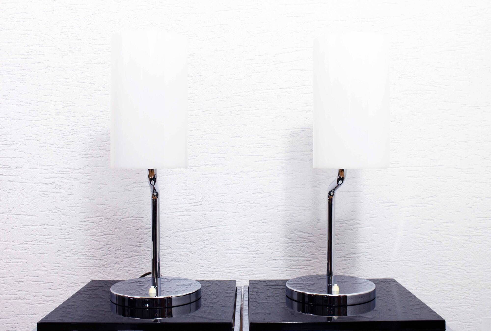 Pair of Italian chrome metal and white acrylic lamps
