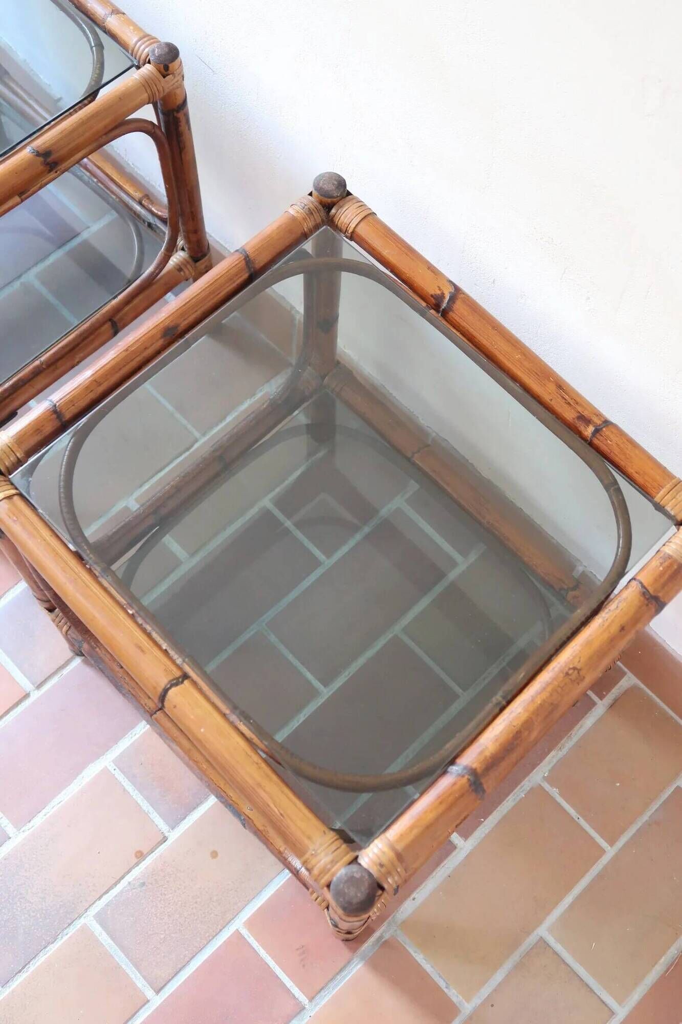 Pair of bamboo and rattan bedside tables, smoked glass tops.
