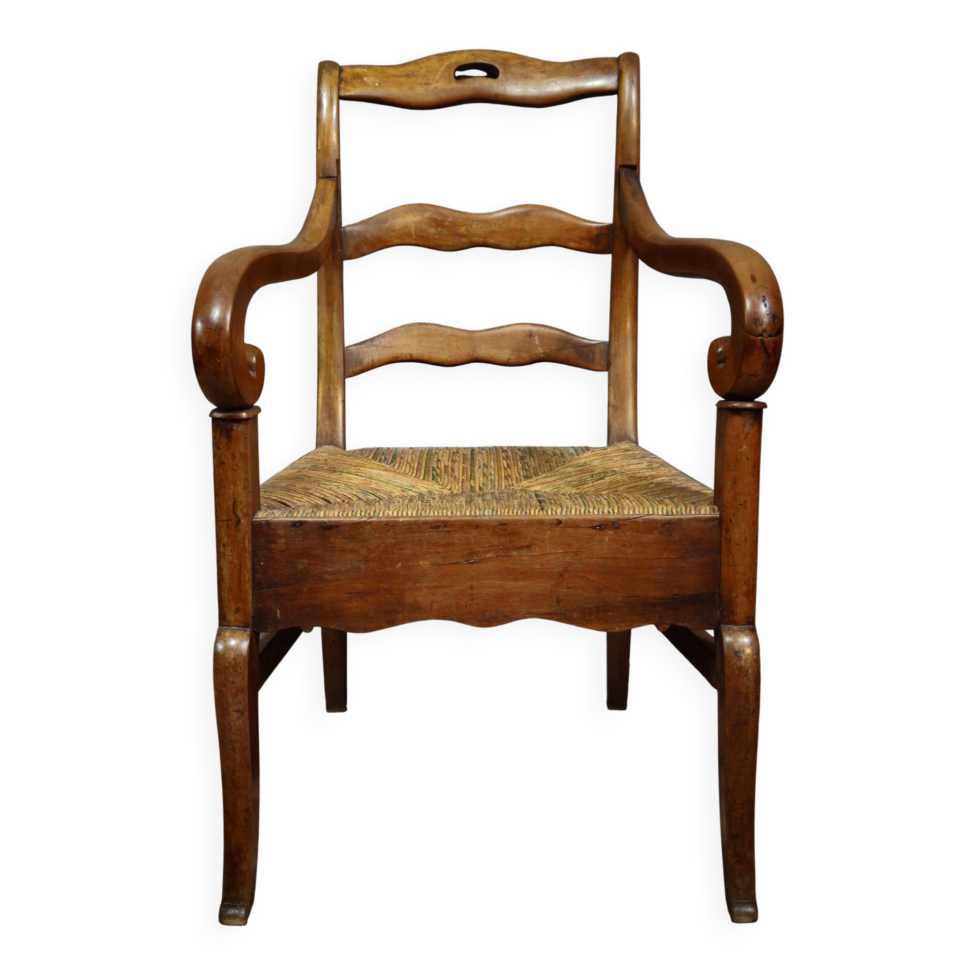 Empire armchair in solid walnut with woven straw seat.