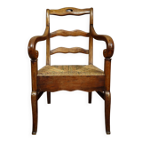 Empire armchair in solid walnut with woven straw seat.