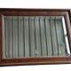 Old bevelled mirror with a wooden frame.