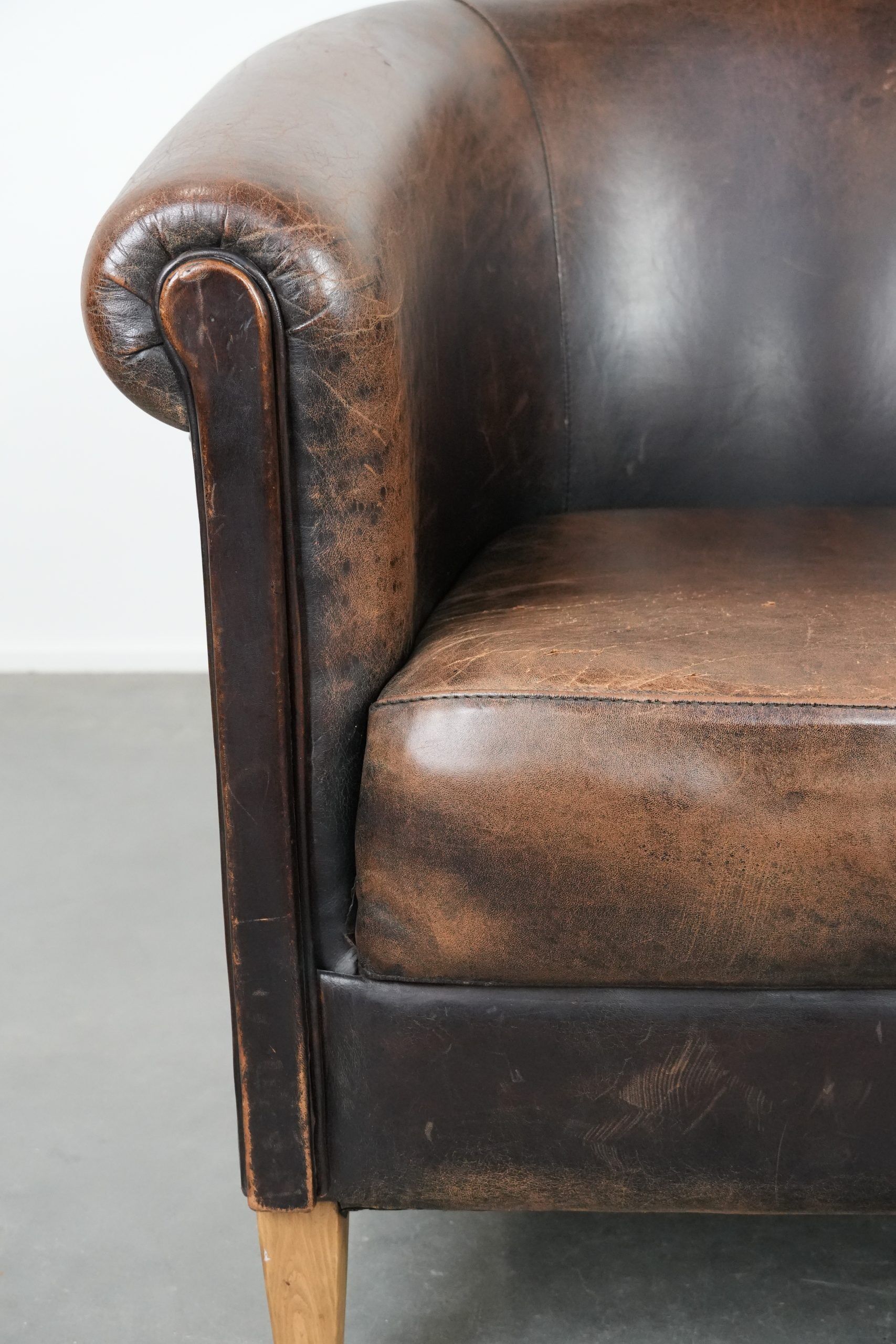 Characterful club armchair made of sheepskin with a beautiful patina
