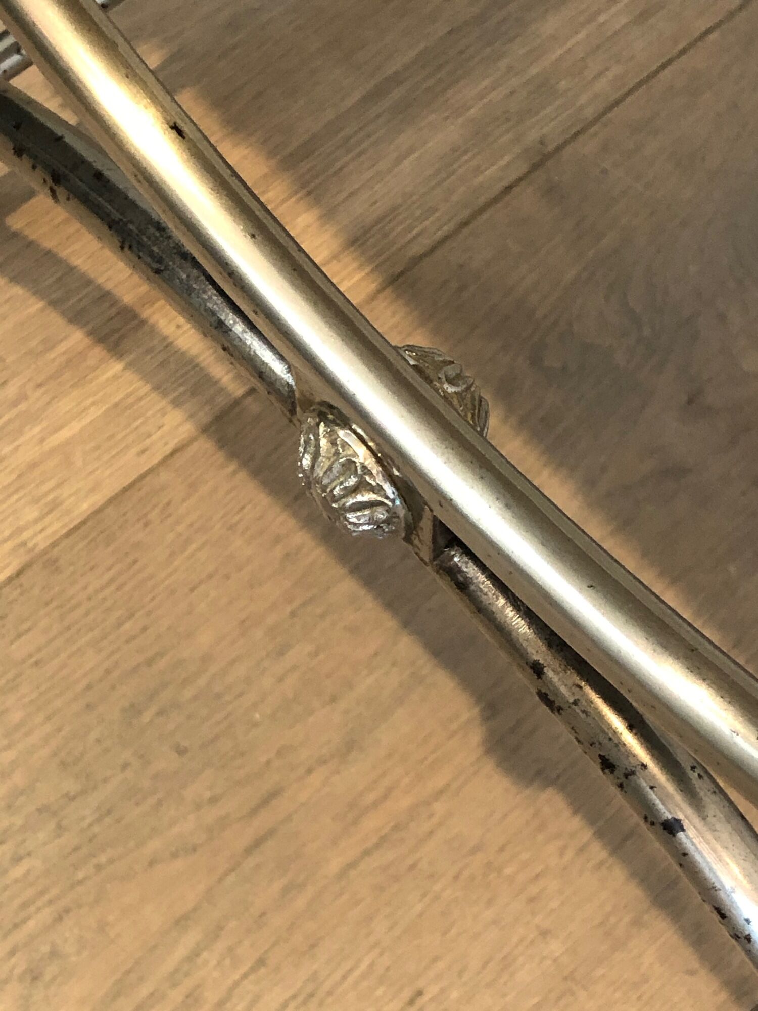 Curule stool in silver steel neoclassical style with swan heads