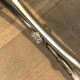 Curule stool in silver steel neoclassical style with swan heads