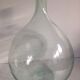 Transparent old demijohn about 8 to 10 L