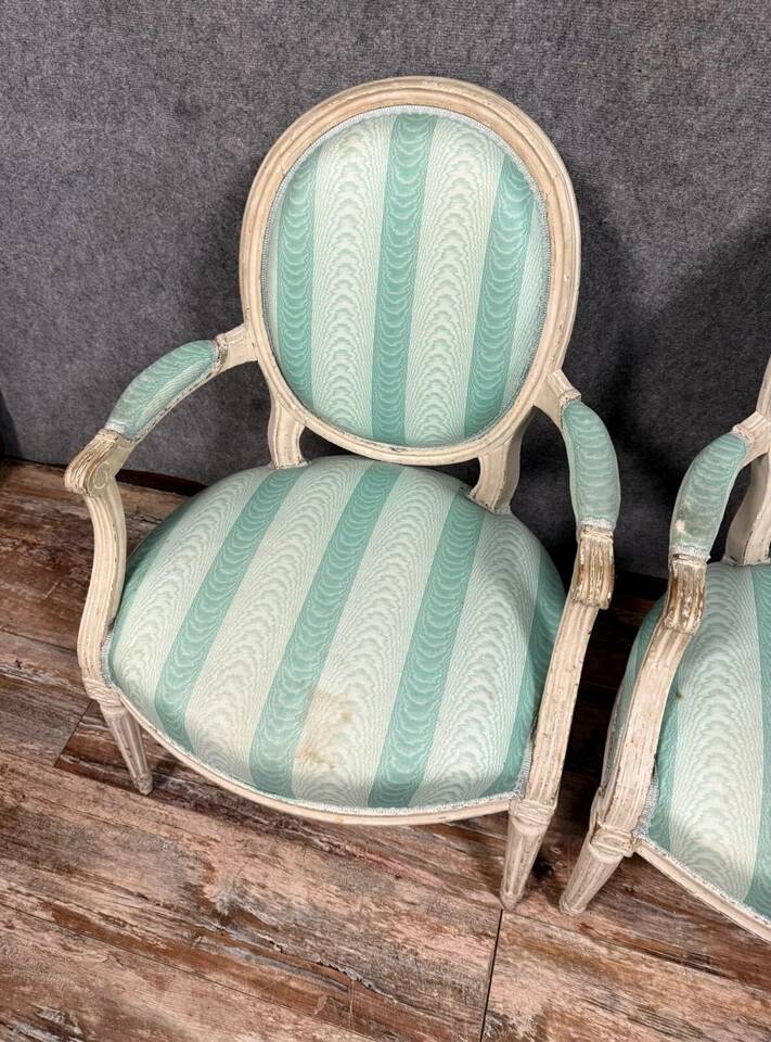 Pair of Louis XVI cabriolet armchairs in lacquered wood, 18th century