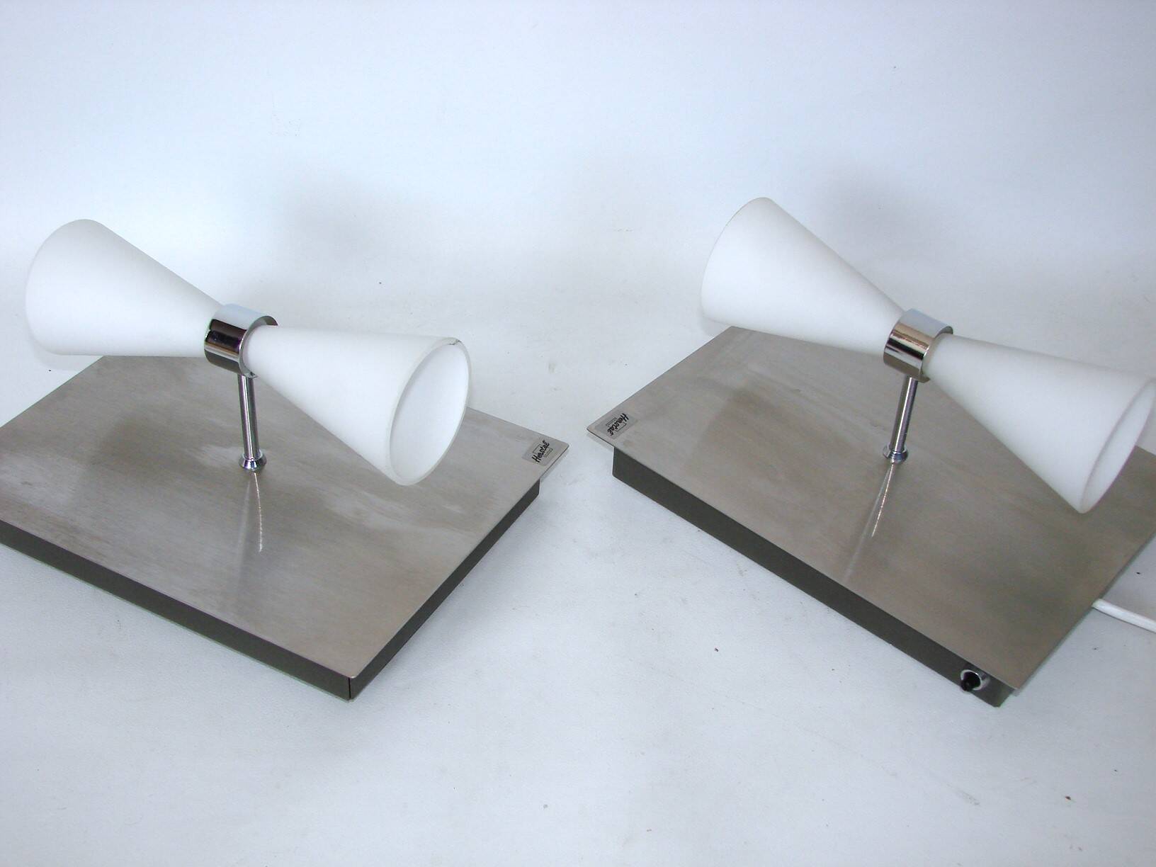 A pair of modern herstal wall lamps from the 2000s - stylish lighting for m