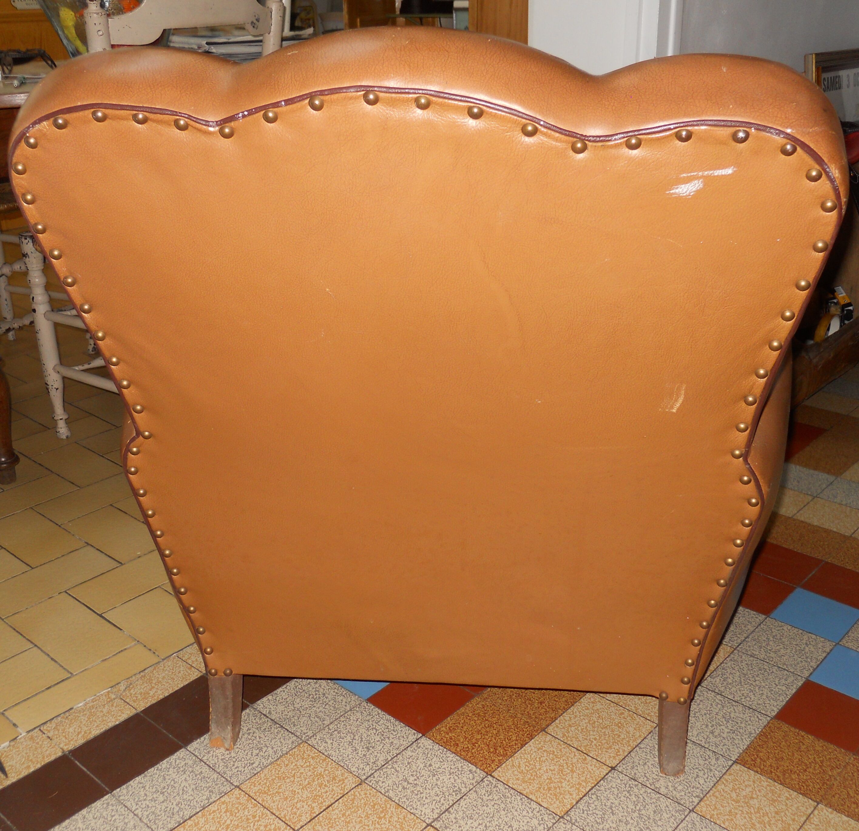 Brown leather club armchair