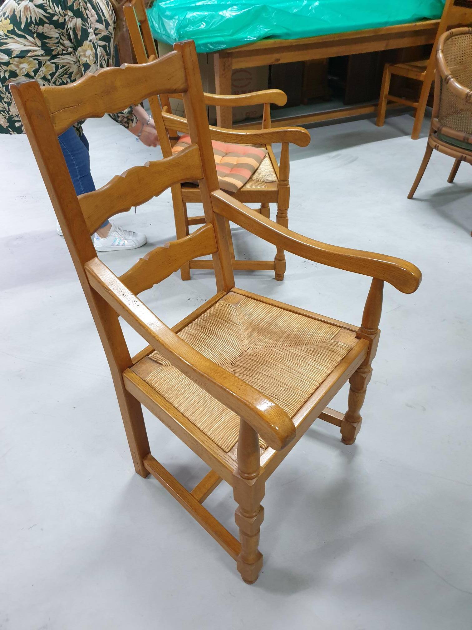 Two oak armchairs with straw seats