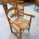 Two oak armchairs with straw seats