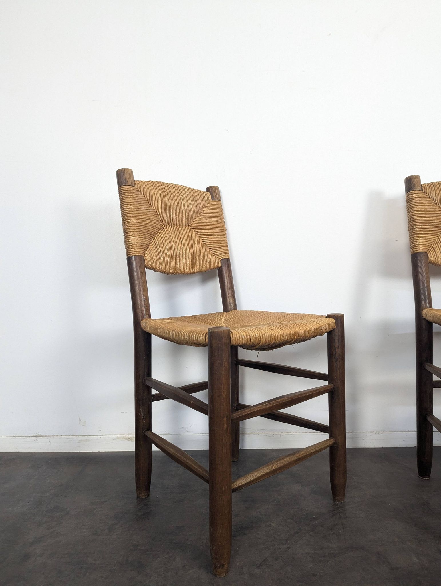 Set of 10 Bauche model chairs by Charlotte Perriand, circa 1960.