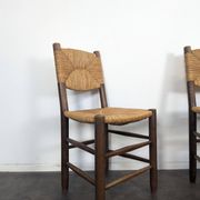 Set of 10 Bauche model chairs by Charlotte Perriand, circa 1960.