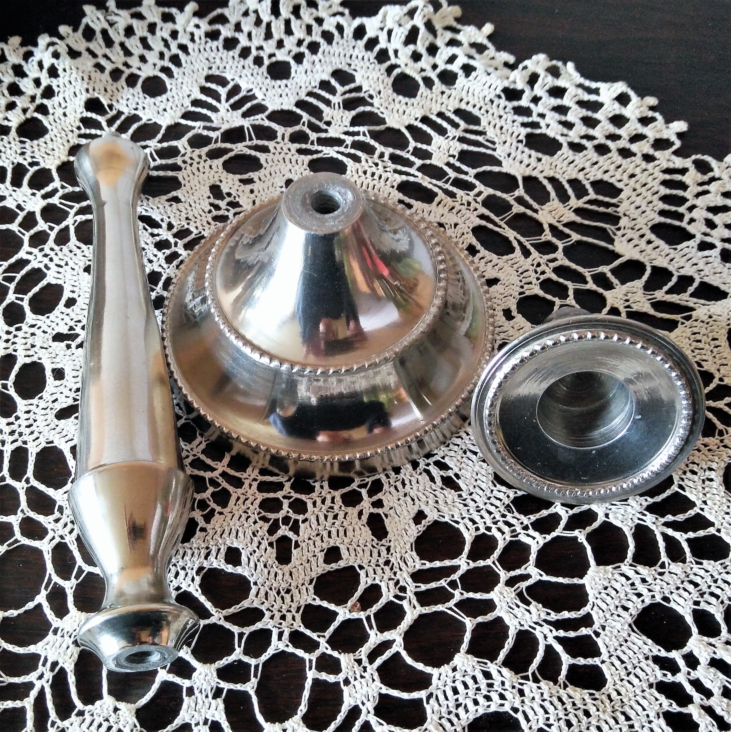 Chromed metal candle holder