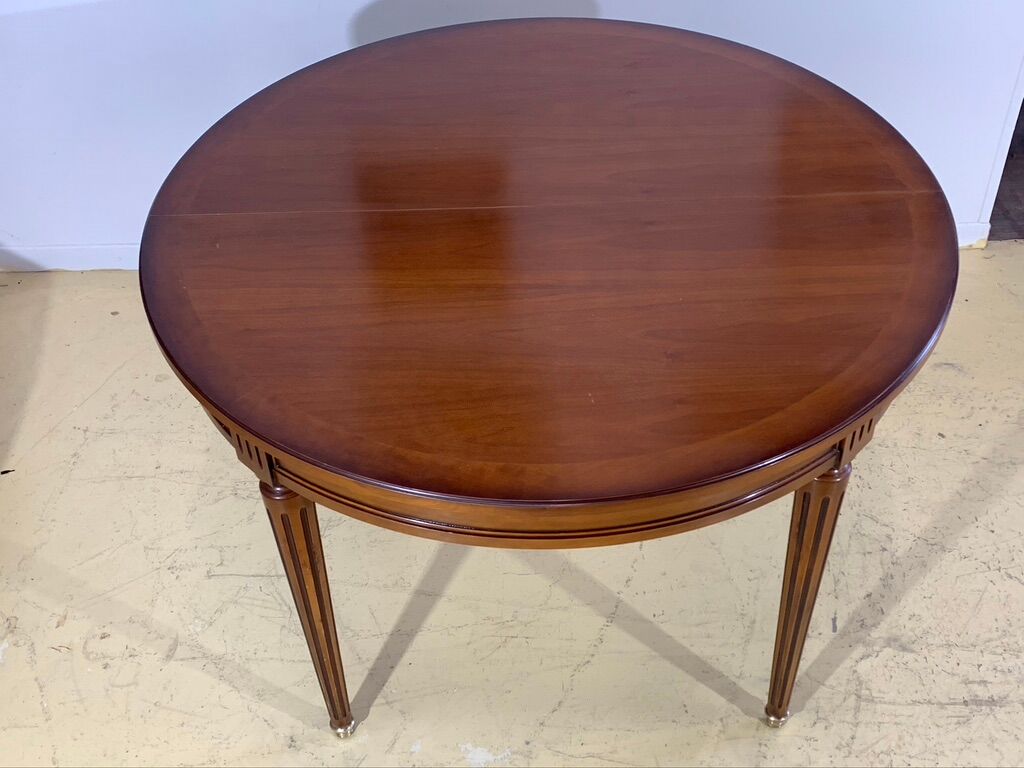 Louis XVl style round table in cherry with extensions