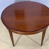 Louis XVl style round table in cherry with extensions
