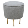 Modern pouf from the Gubi brand in grey fabric and brass.