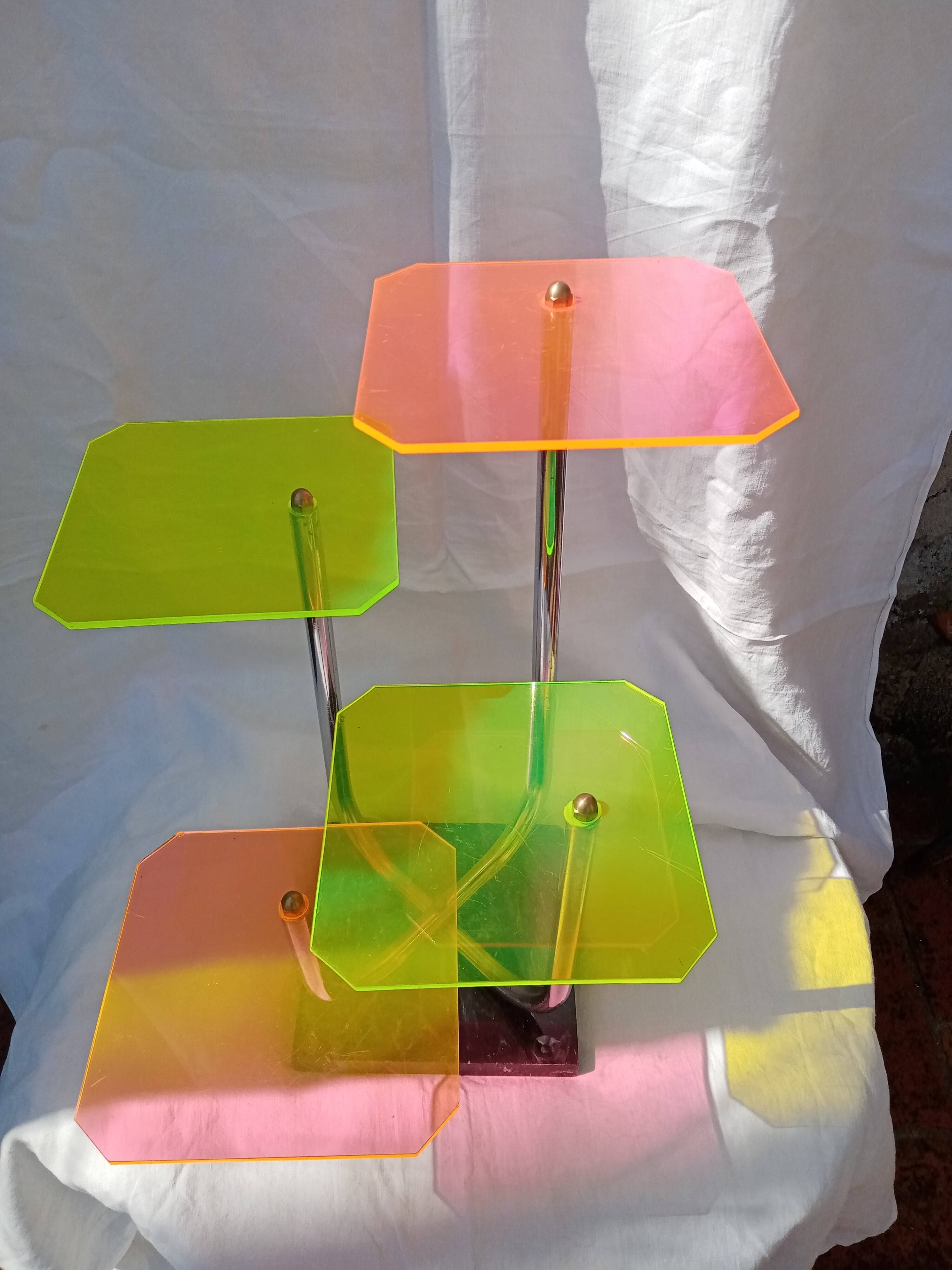 Display shelf with plexiglass trays in 1970s colours.