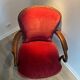 Antique armchair in burgundy velvet
