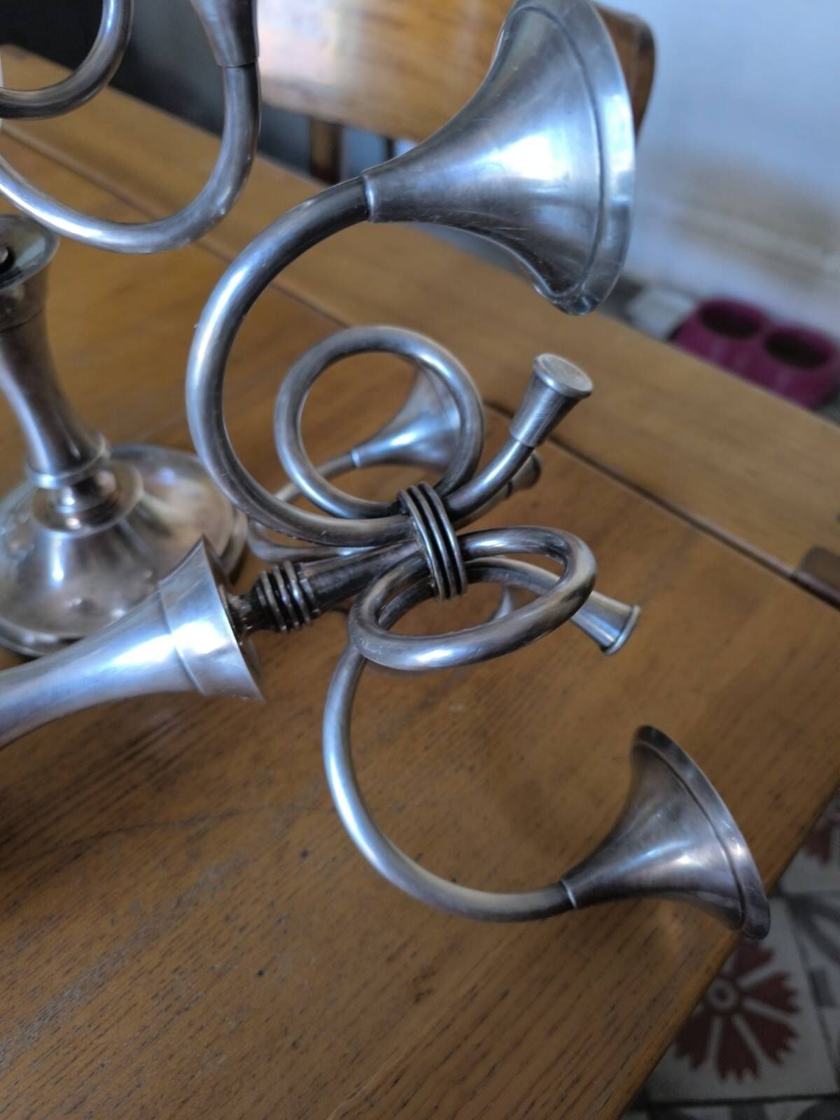 Ercuis pair of candlesticks model Cheverny in silver-plated metal with hunting horn decoration.