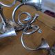 Ercuis pair of candlesticks model Cheverny in silver-plated metal with hunting horn decoration.