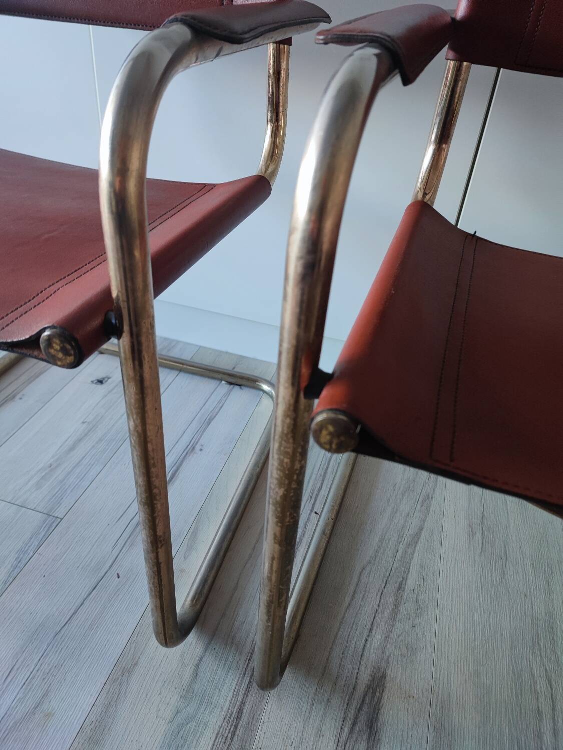 B34 armchairs, cognac leather and gilding
